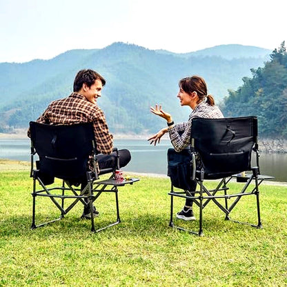 Two directors camping chairs by a lake