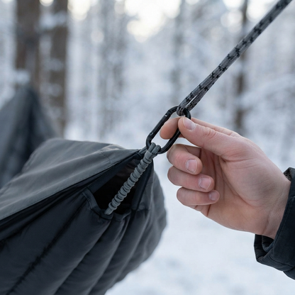 Clipping the elastic strap onto a hammock rope