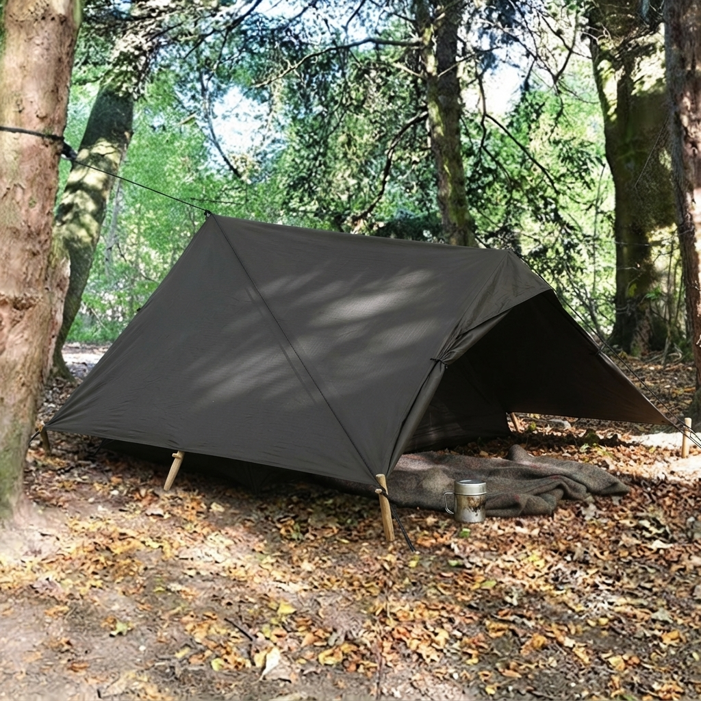 Tarp pitched low as a ground shelter