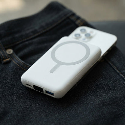 Mini powerbank for iPhone standing on edge to show its thickness