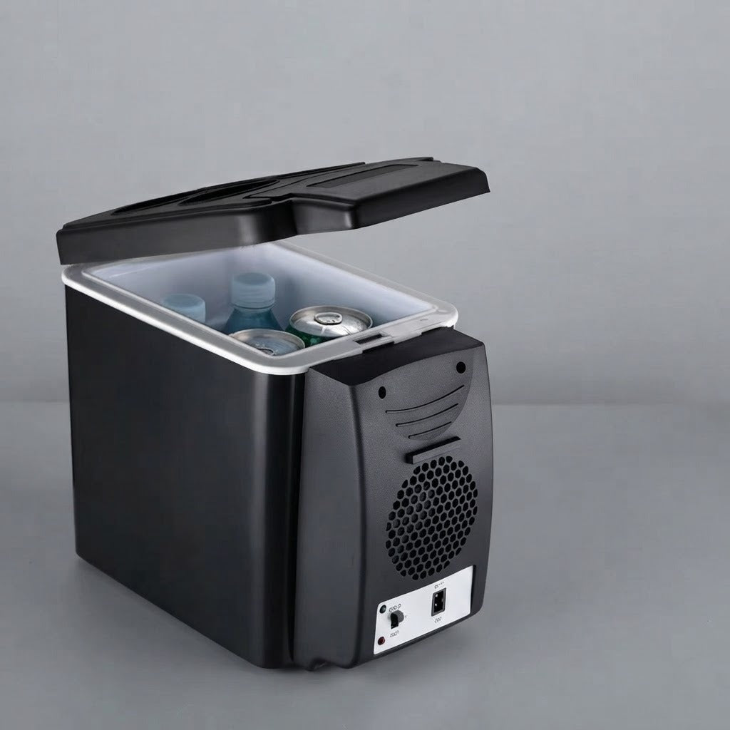 Mini car fridge open on a desk in a small room