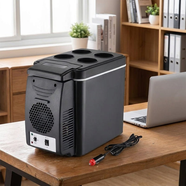 6L car cool box running on a desk beside a laptop