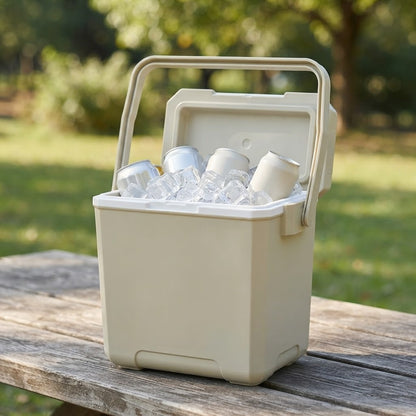 Insulated cooler box open on a picnic table with ice and drinks inside