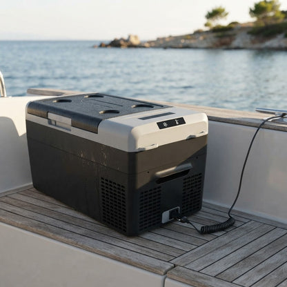 12v portable cooler running on a boat deck by the sea