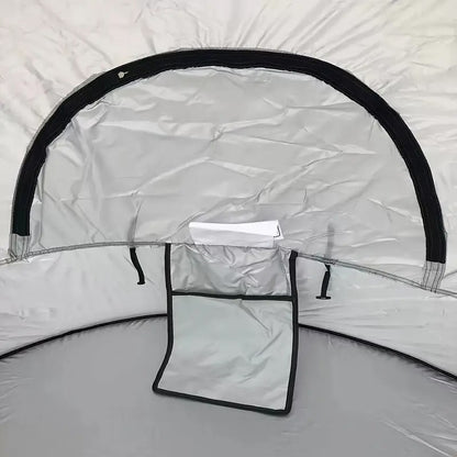 inside a pop up beach tent showing the window panel and seams