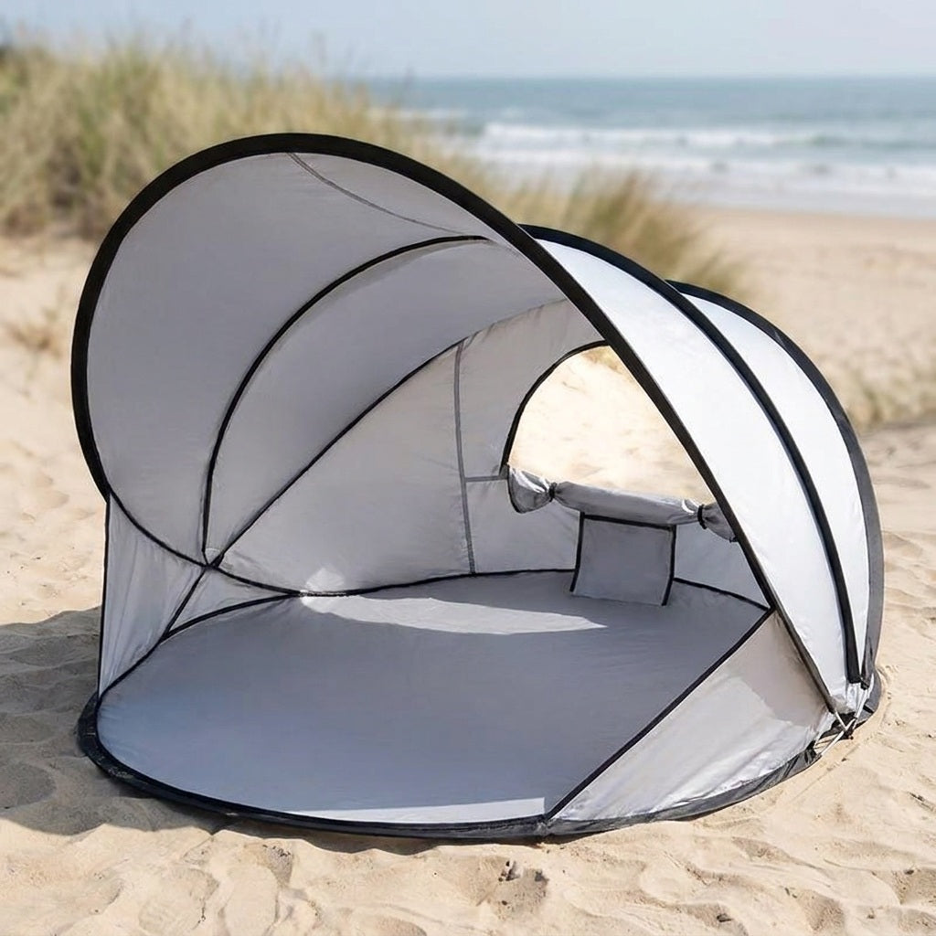 pop up beach tent open on sand as a sun shade shelter
